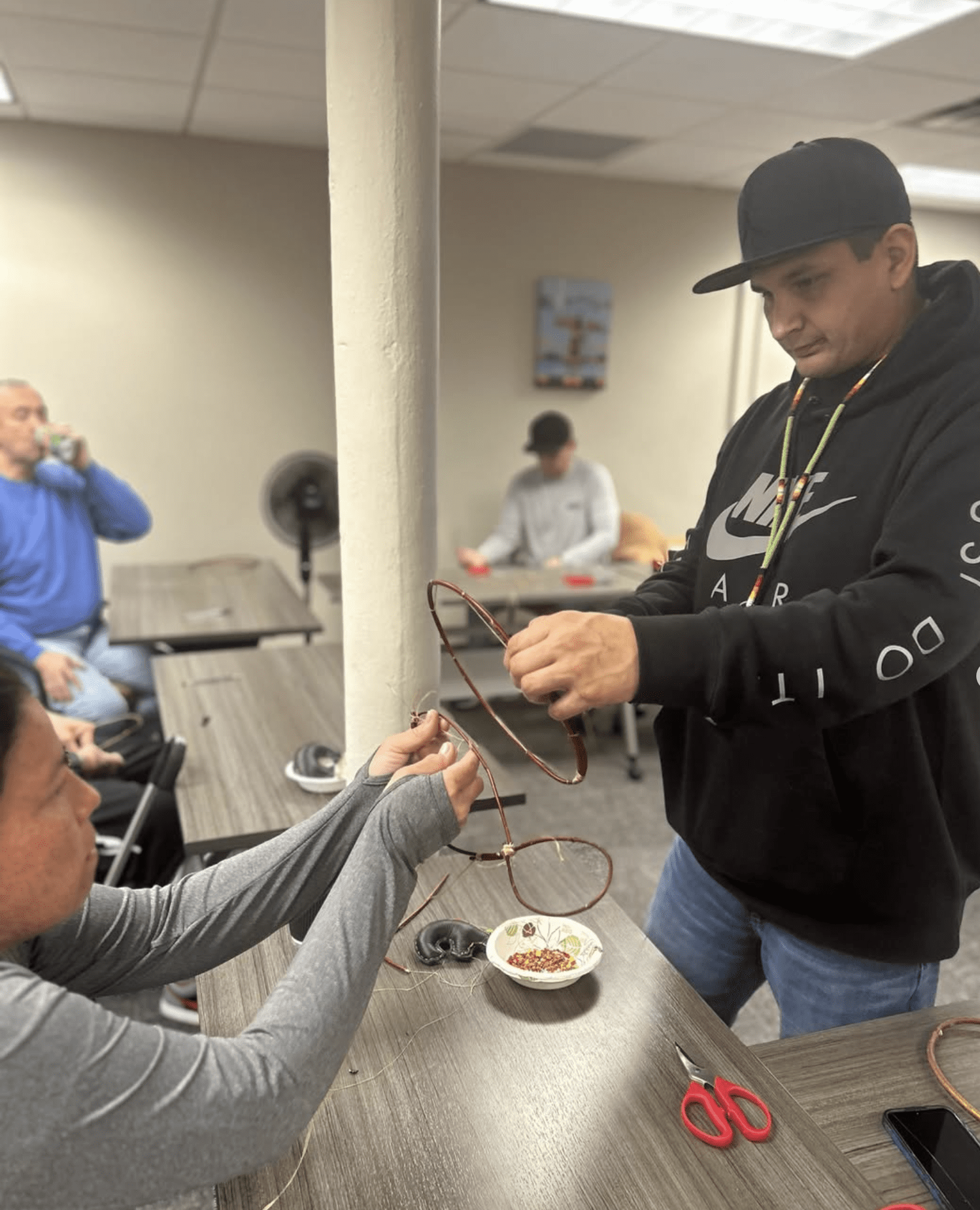 a person holding a wire around a person