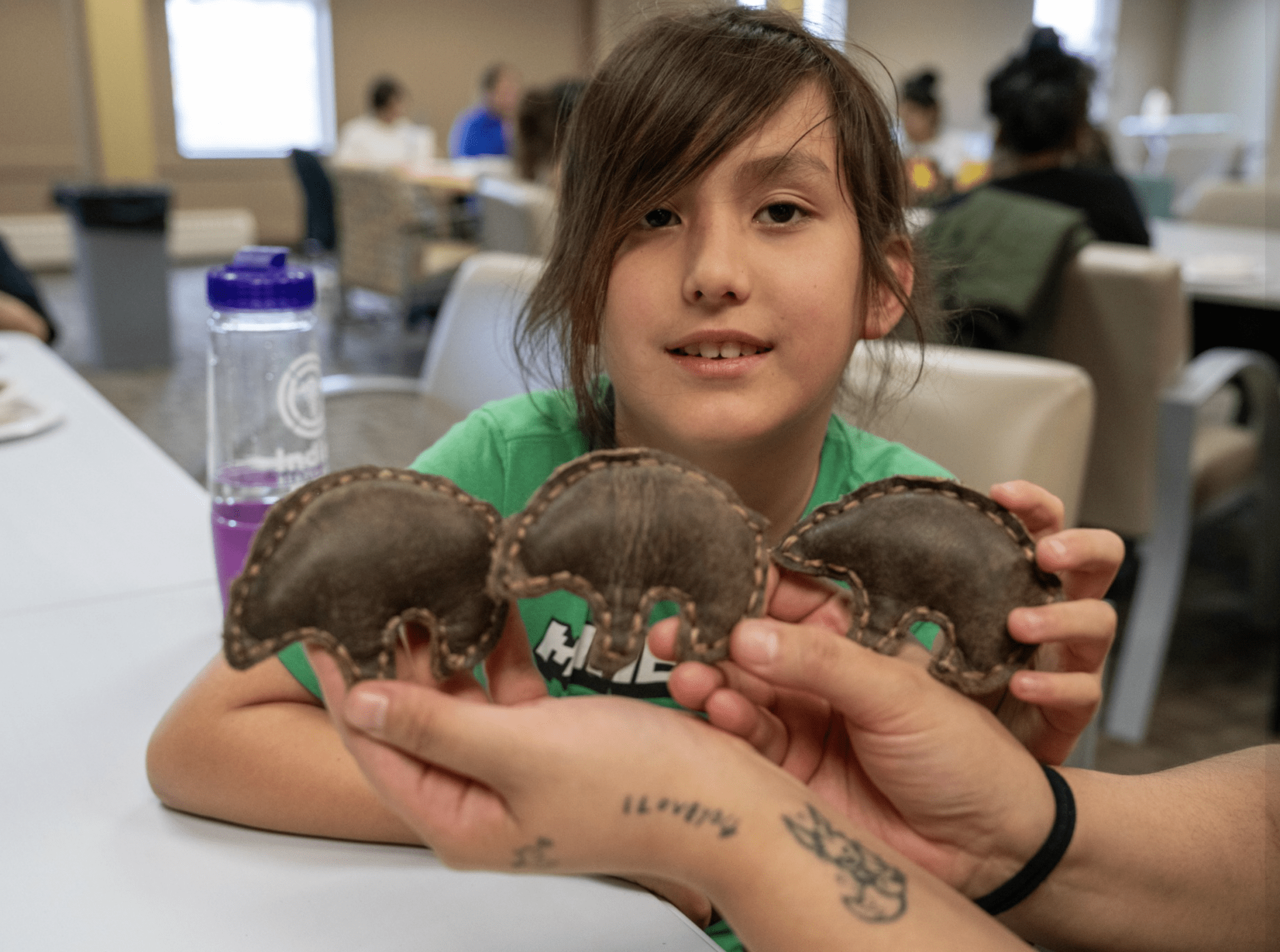 a child holding brown objects