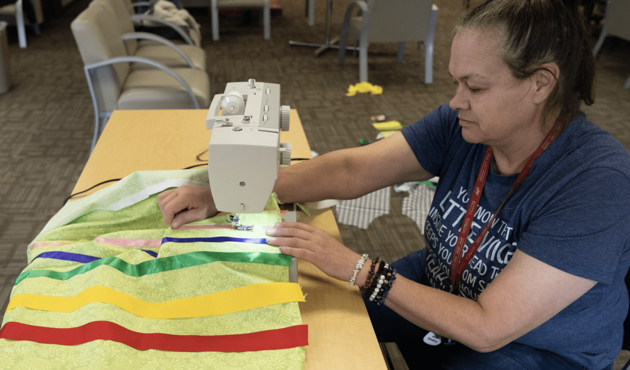 a person using a sewing machine