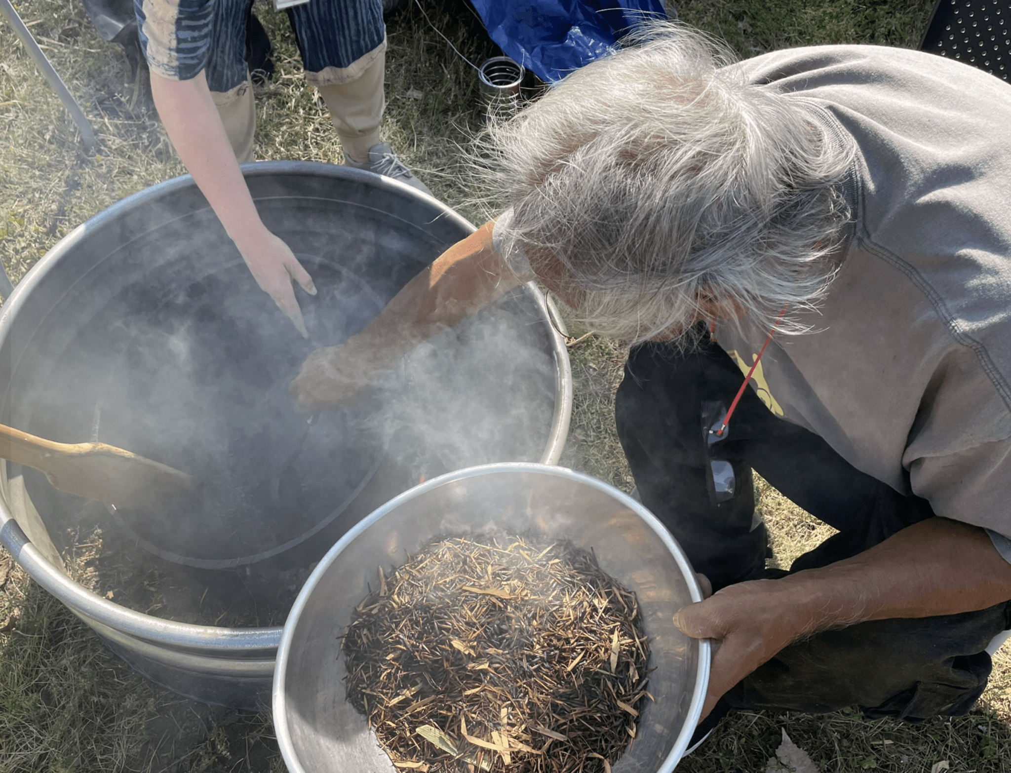 a person holding a bucket of smoke
