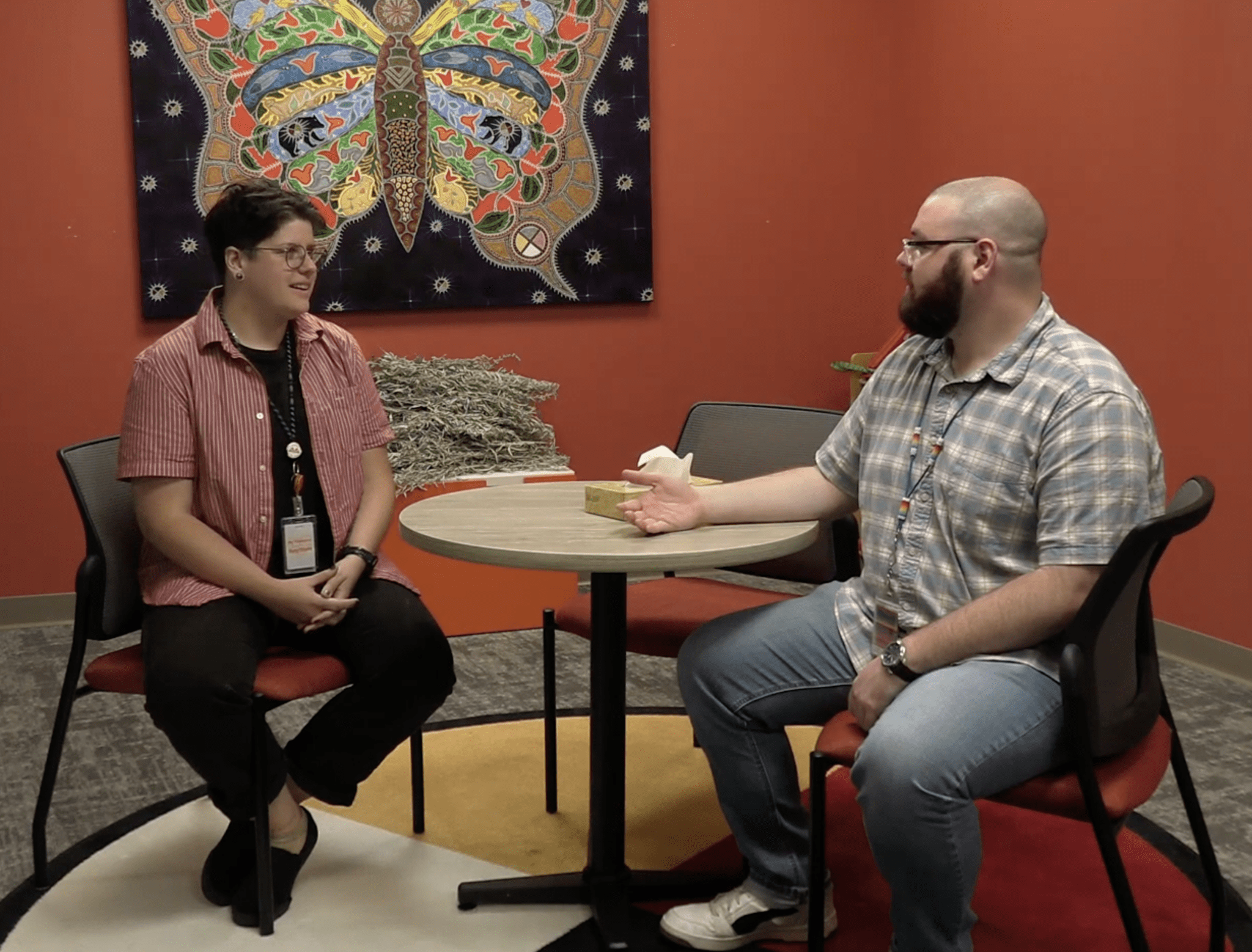 a person and person sitting at a table