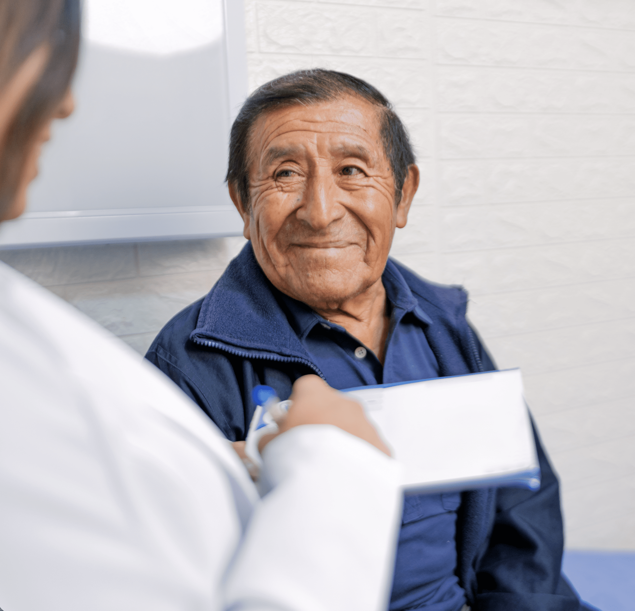 a person smiling at a doctor