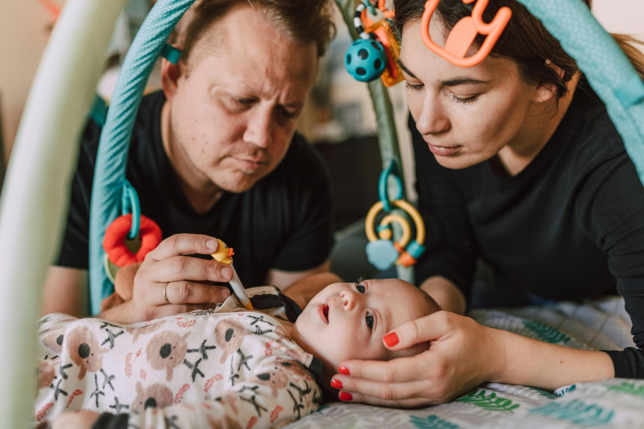 a person and person looking at a baby